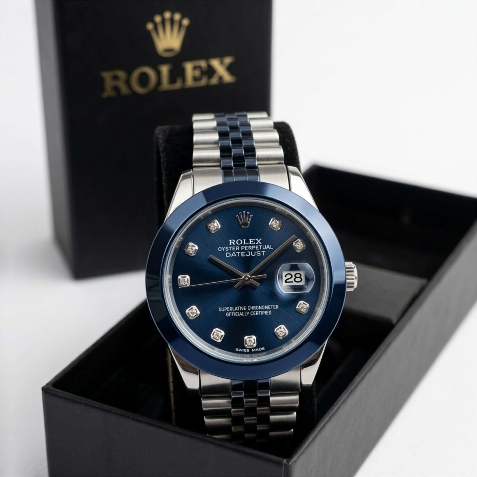 Watch with blue face and silver bracelet in a black box
