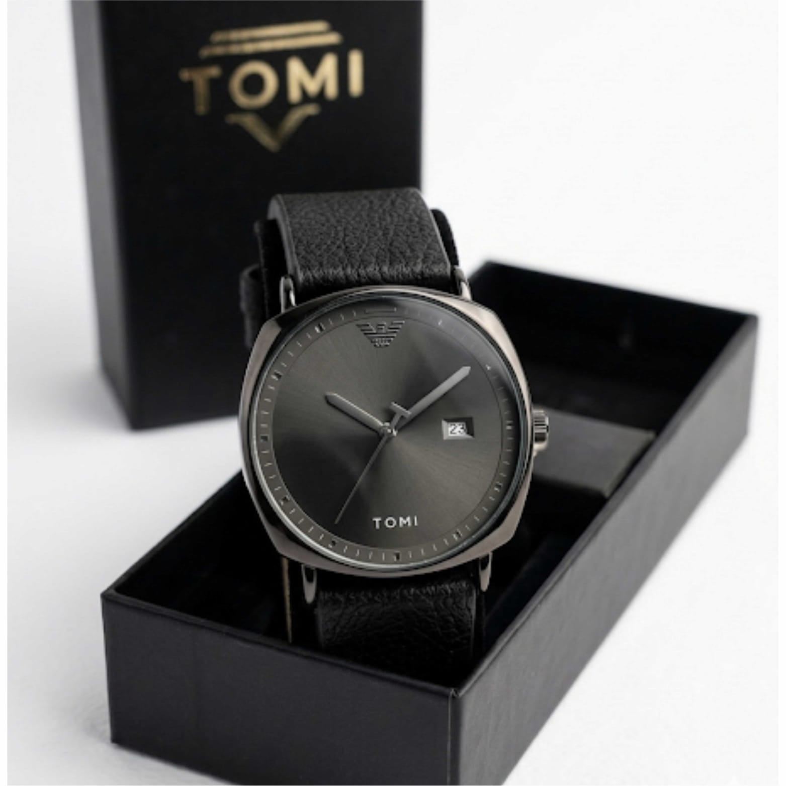 Black watch with leather strap in a Tomi box